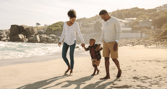 Family on beach vacation budgeting 