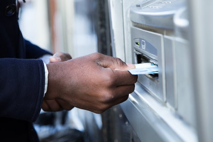 close-up-of-man-taking-cash-from-atm